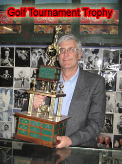 Greg Bordner holds Trophy